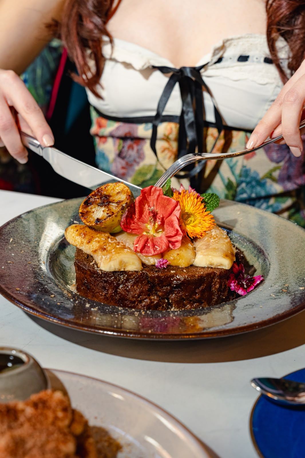 Maïra Ignazzi — hands plating a baked dessert